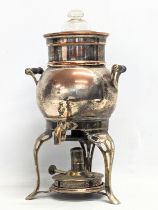 An Early 20th Century copper and brass tea urn. 34cm