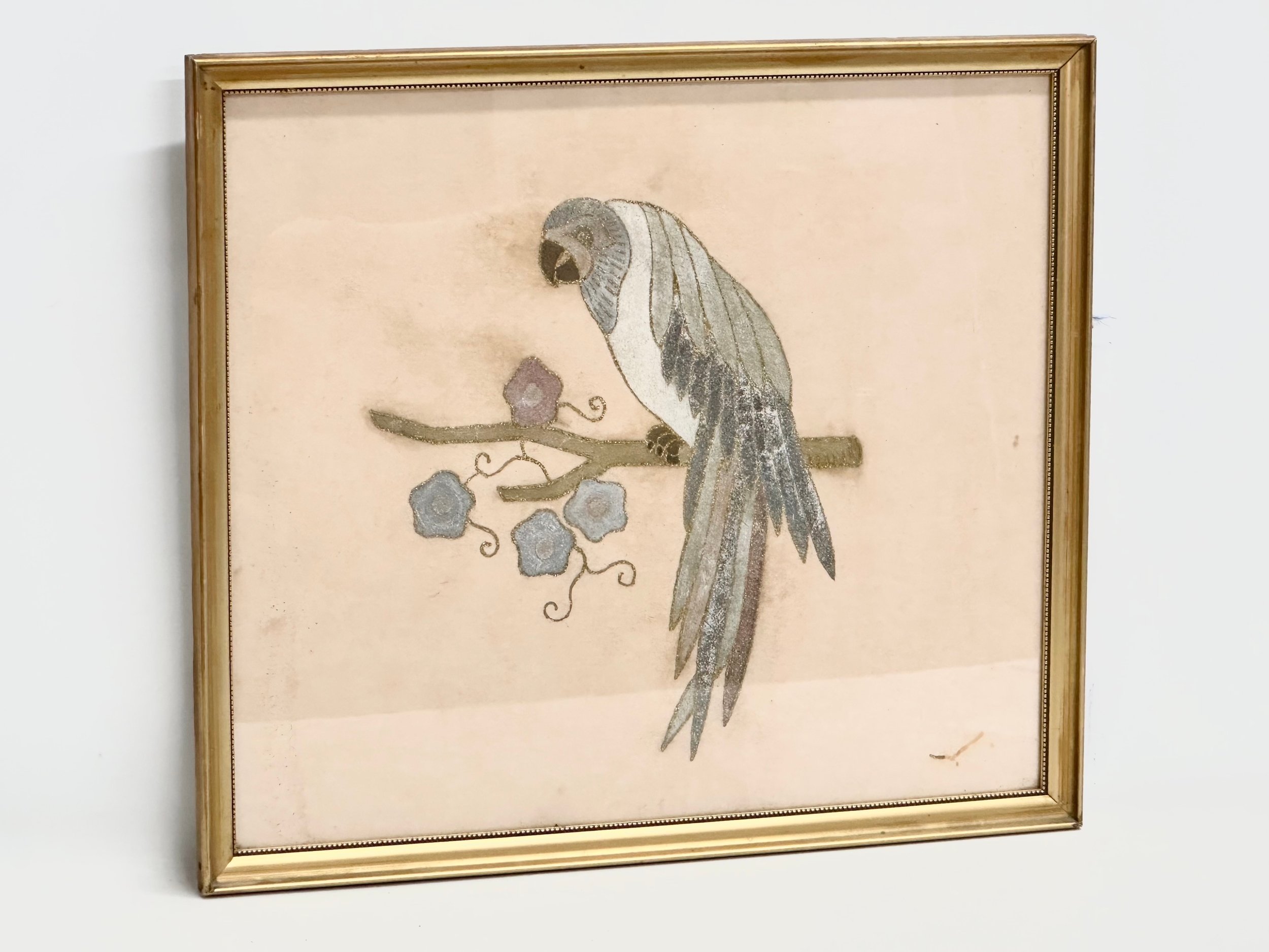 A vintage gilt embroidered parrot in gilt frame. 53x46.5cm