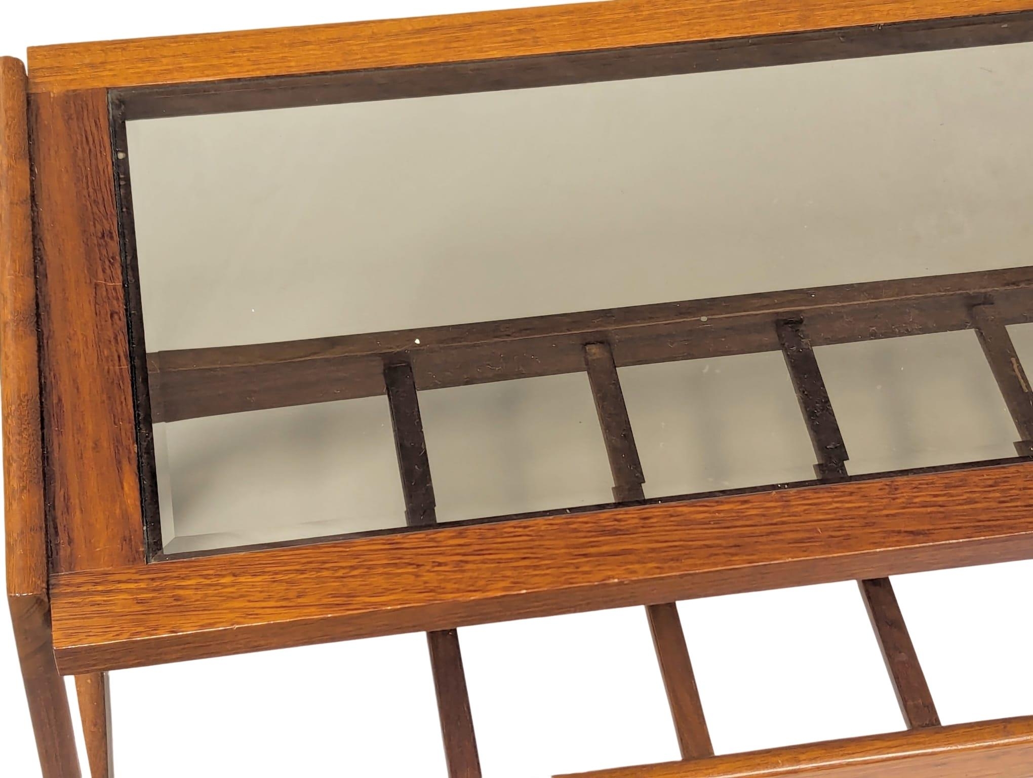 A Mid Century teak and glass top coffee table. 106.5x47.5x43cm - Image 2 of 6