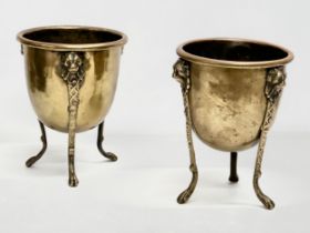 A pair of Mid/Late 19th Century brass jardinières/planters raised on 3 lion paw feet and copper