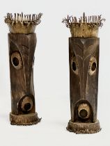 A pair of 20th Century African style wood and brass candleholders. 30cm