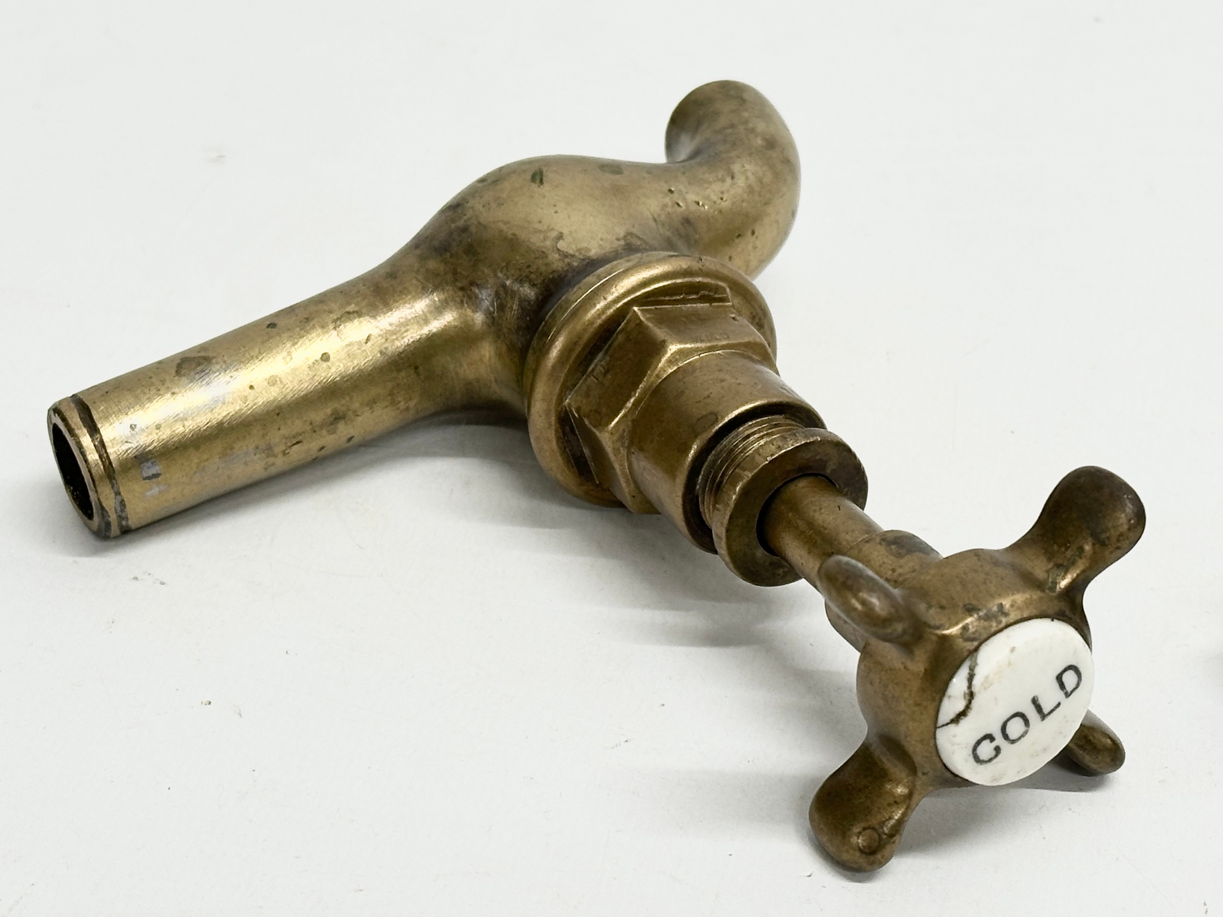 Victorian brassware. A pair of Victorian brass fireplace stands with a pair of Victorian brass taps. - Image 4 of 4