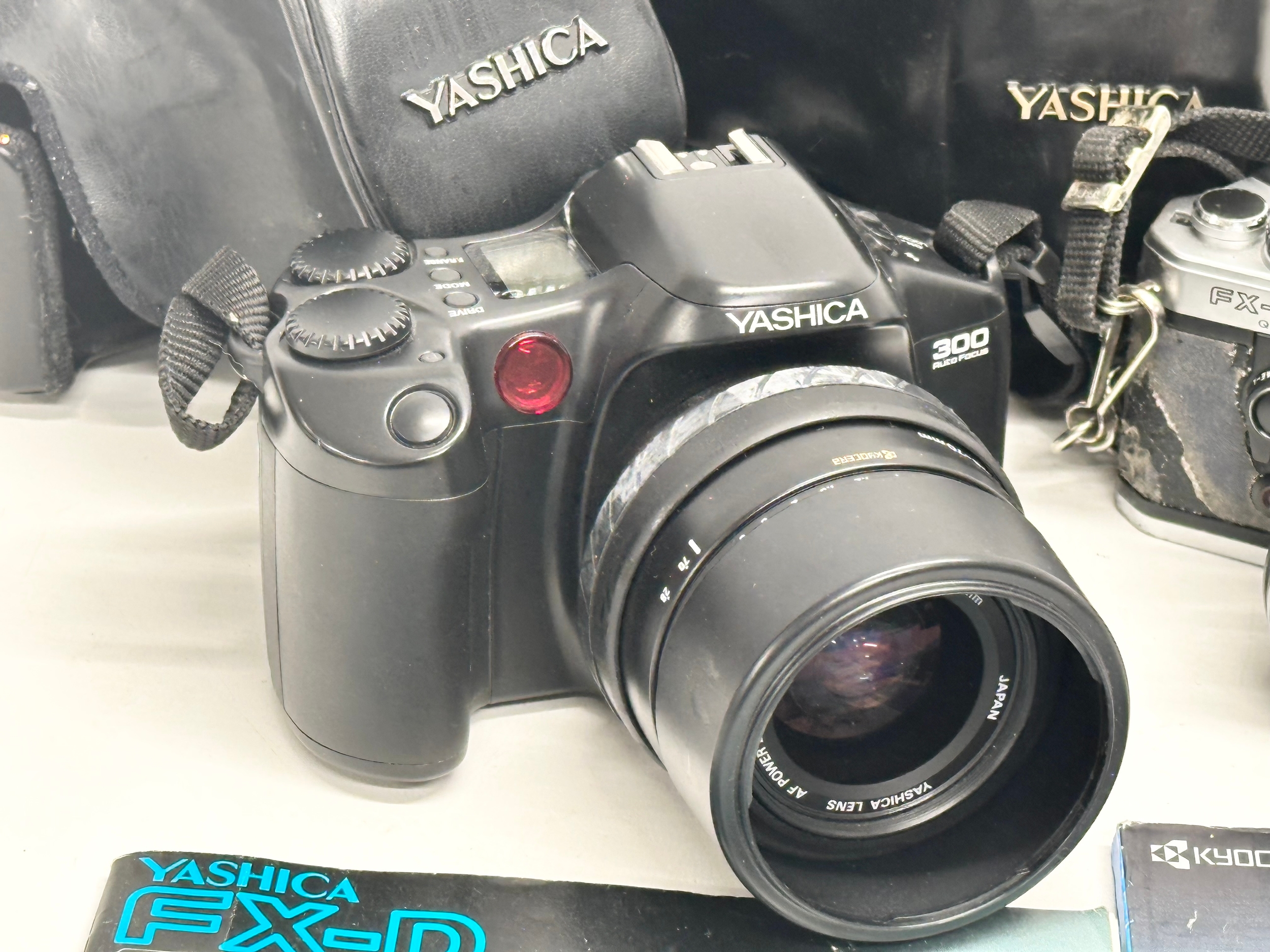 2 Yashica cameras. A Yashica 300 Auto Focus camera with case and book. A Yashica FX-D Quartz - Image 2 of 4