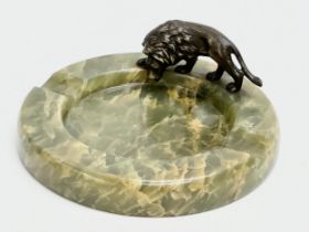 An Early 20th Century onyx ashtray with bronze lion. 12x12cm