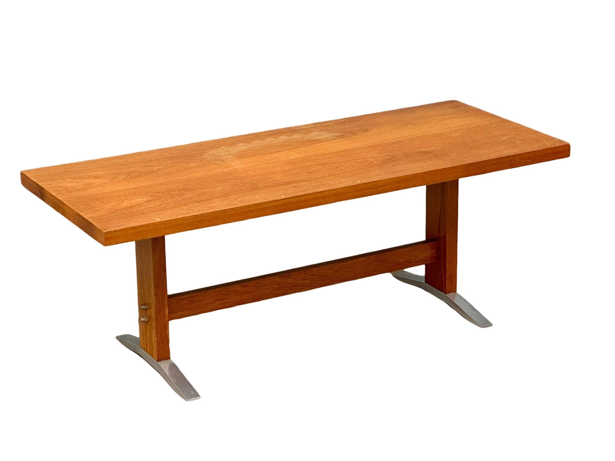 A Danish Mid Century teak coffee table on chromed feet. 120x48x44cm