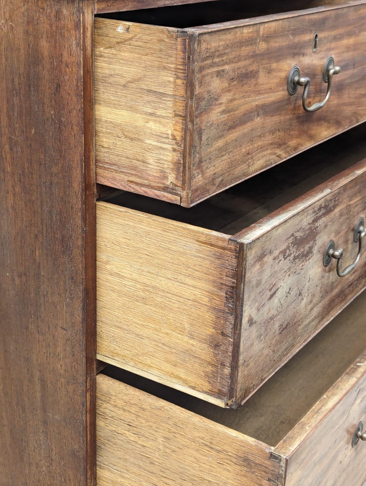 A George III mahogany oak lined chest of drawers on ogee feet and original brass drop handles. Circa - Image 3 of 5