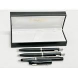 3 Parker pens with case.