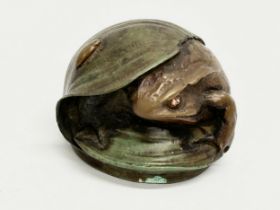 A St Petersburg bronze frog paperweight.