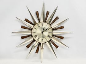 A Mid Century sunburst wall clock by Metamec. 60cm