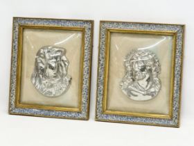 A pair of Early 20th Century plated religious wall plaques with convex glass and gilt frames.