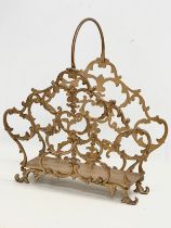 A vintage gilt metal magazine rack. 45x51cm