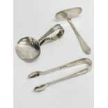 Silver tongs, baby spoon and pusher. 59.80 grams.