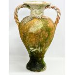 A large terracotta garden pot. 48x37x72cm