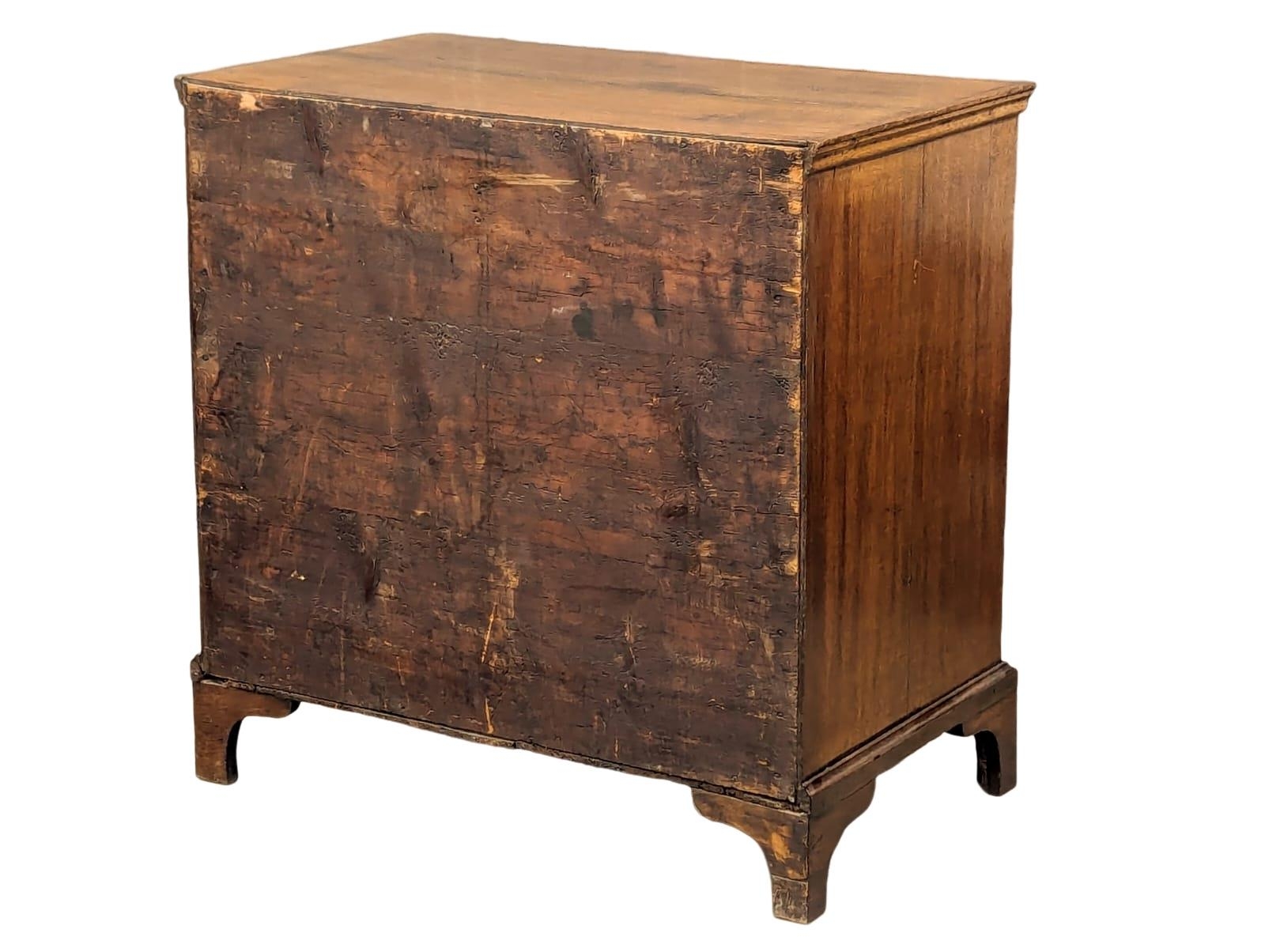 A George II oak chest of drawers with original handles and bracket feet, 94.5cm x 54.5cm x 94.5cm - Image 3 of 8