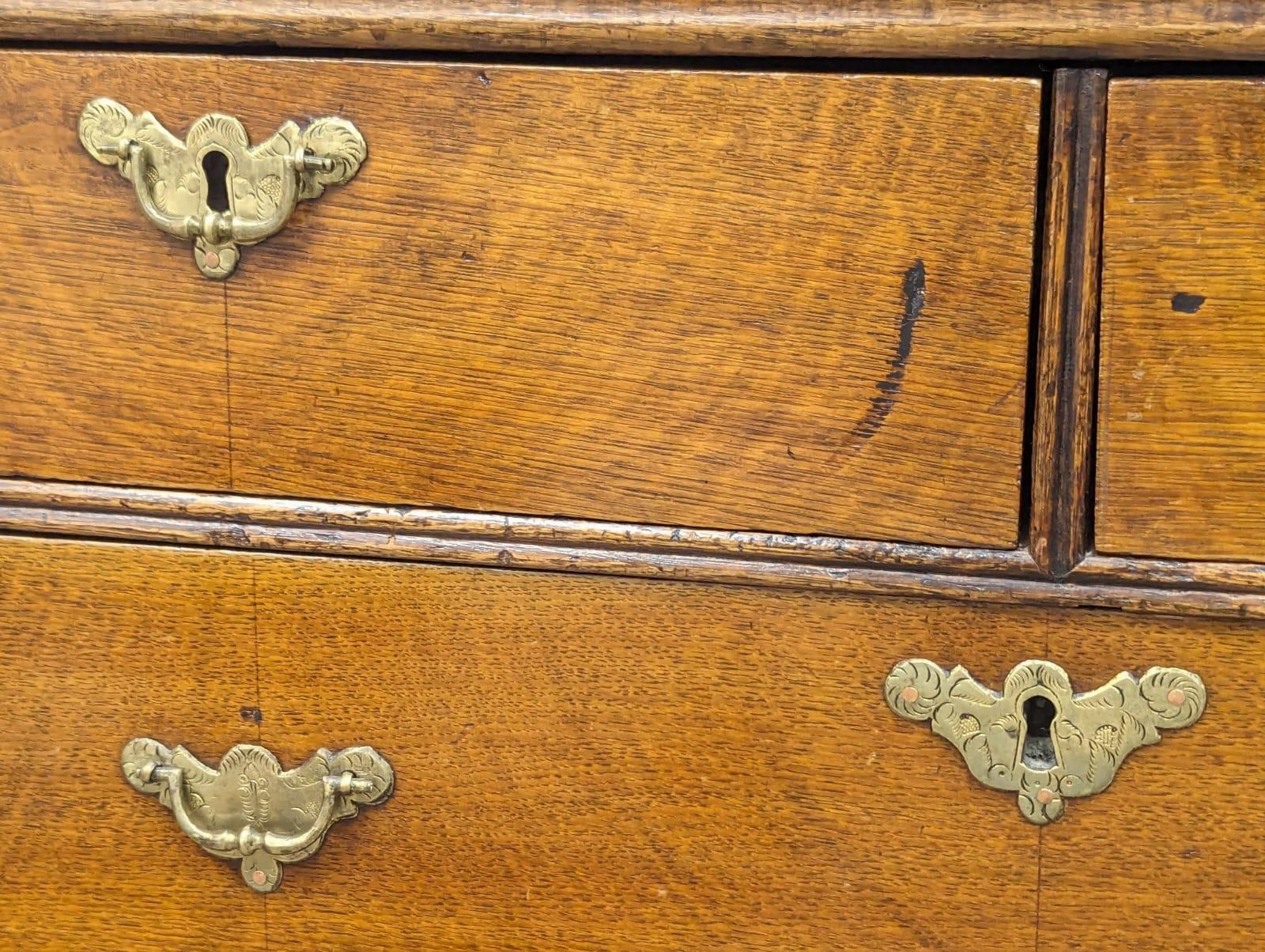 A George II oak chest of drawers with original handles and bracket feet, 94.5cm x 54.5cm x 94.5cm - Image 2 of 8