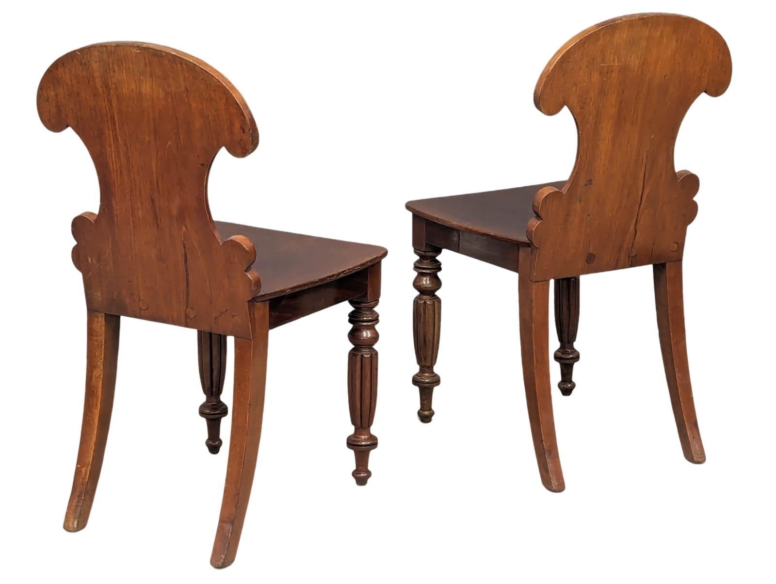A pair of late George IV-Early William IV ornate mahogany hall chairs - Image 6 of 6