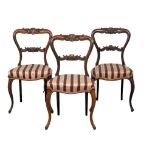 A set of 3 Victorian rosewood balloon back chairs on Cabriole legs