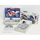 2 Tamiya model kits. A Tamiya Honda NSR 500. A Tamiya Suzuki RGV-1.