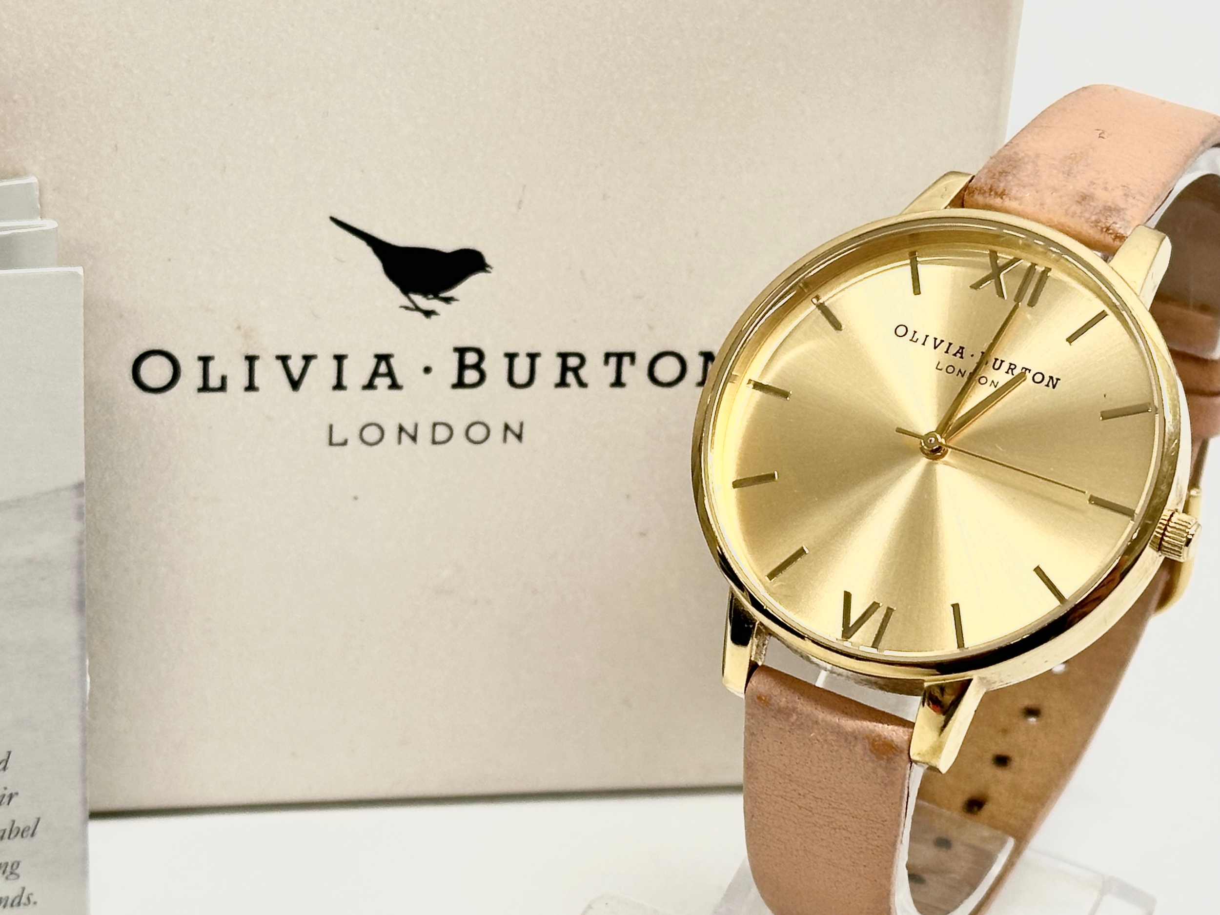 An Olivia Burton watch with box.