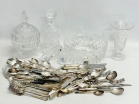 A collection of silver plated cutlery and crystal.