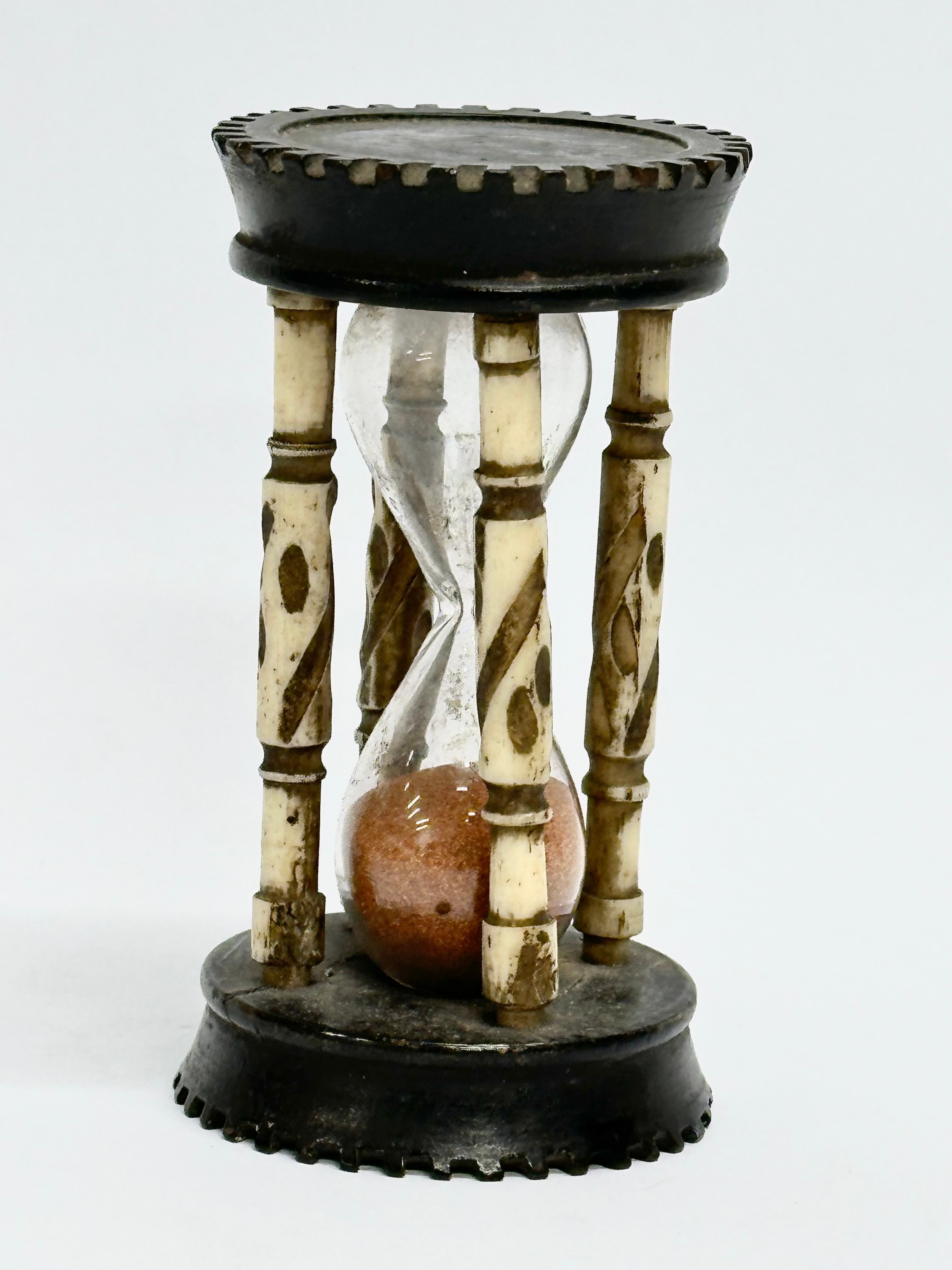 A Late 19th Century bone and ebony hourglass. 9.5cm - Image 5 of 5