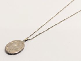 A silver locket and chain, J. A. Main Ltd, Birmingham, 1972. 8.63g