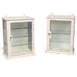 A pair of 1950s wall hanging dental cabinets stamped Arnold & Sons London,