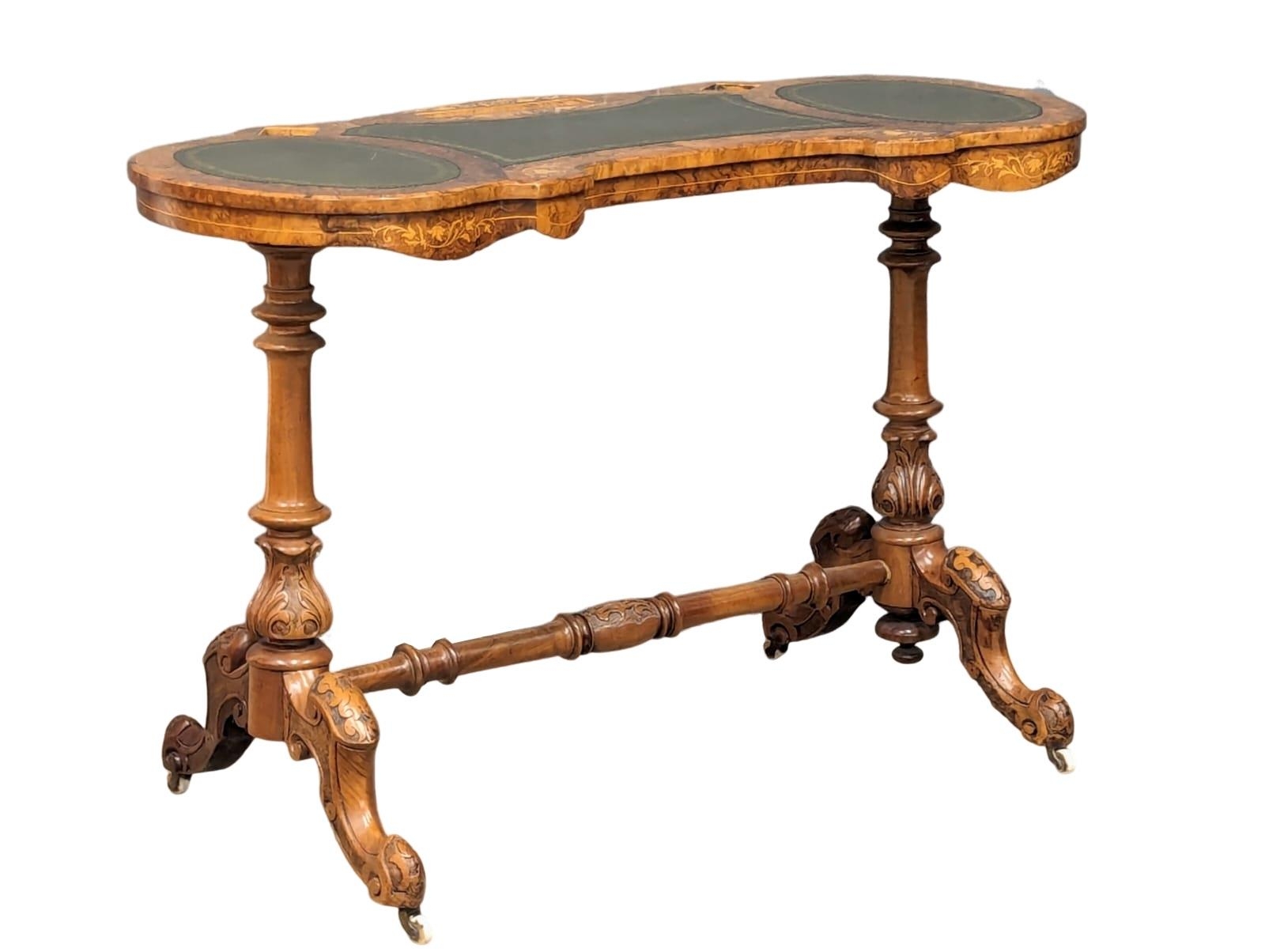 A Mid Victorian Burr Walnut writing table with a tooled leather top. Circa 1860s. 105x48x71cm