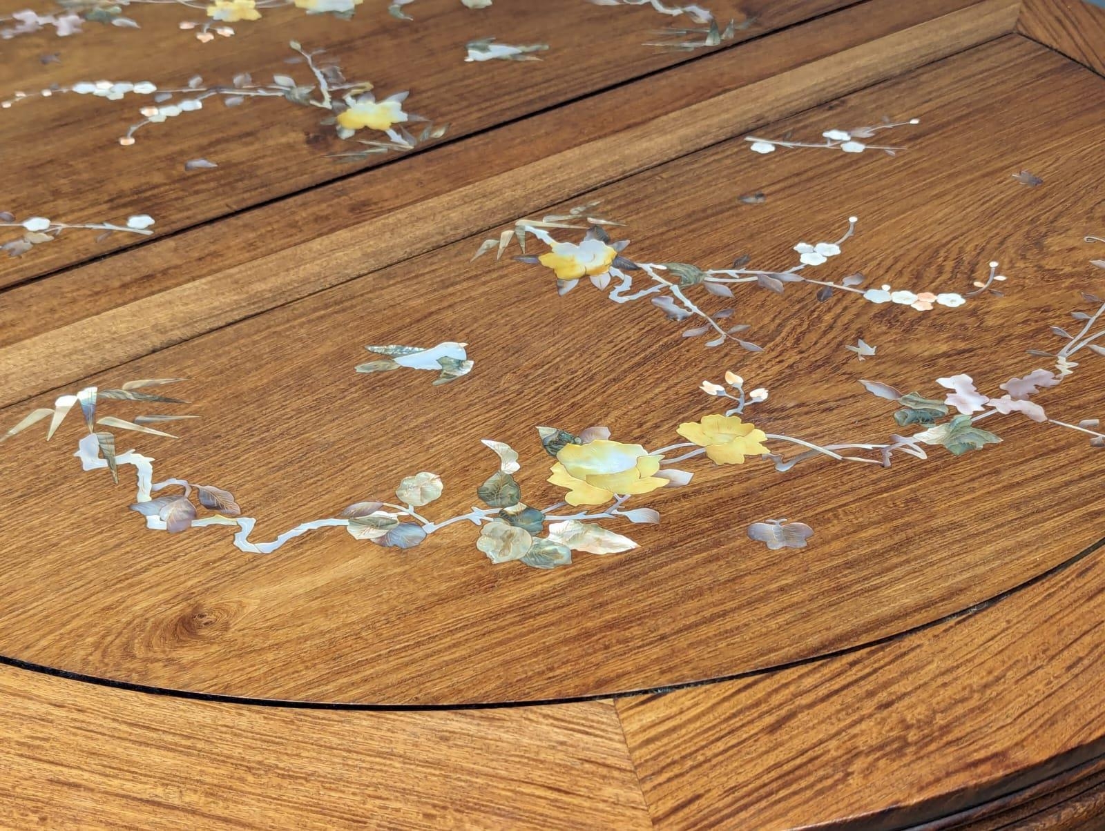A Chinese rosewood 2 leaf extending dining table and 6 chairs with Mother of Pearl inlay. - Image 7 of 11