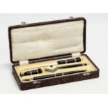 An Early 20th Century C. Brandauer pen set in case. Inkwell, seal, fountain pen, letter opener etc.