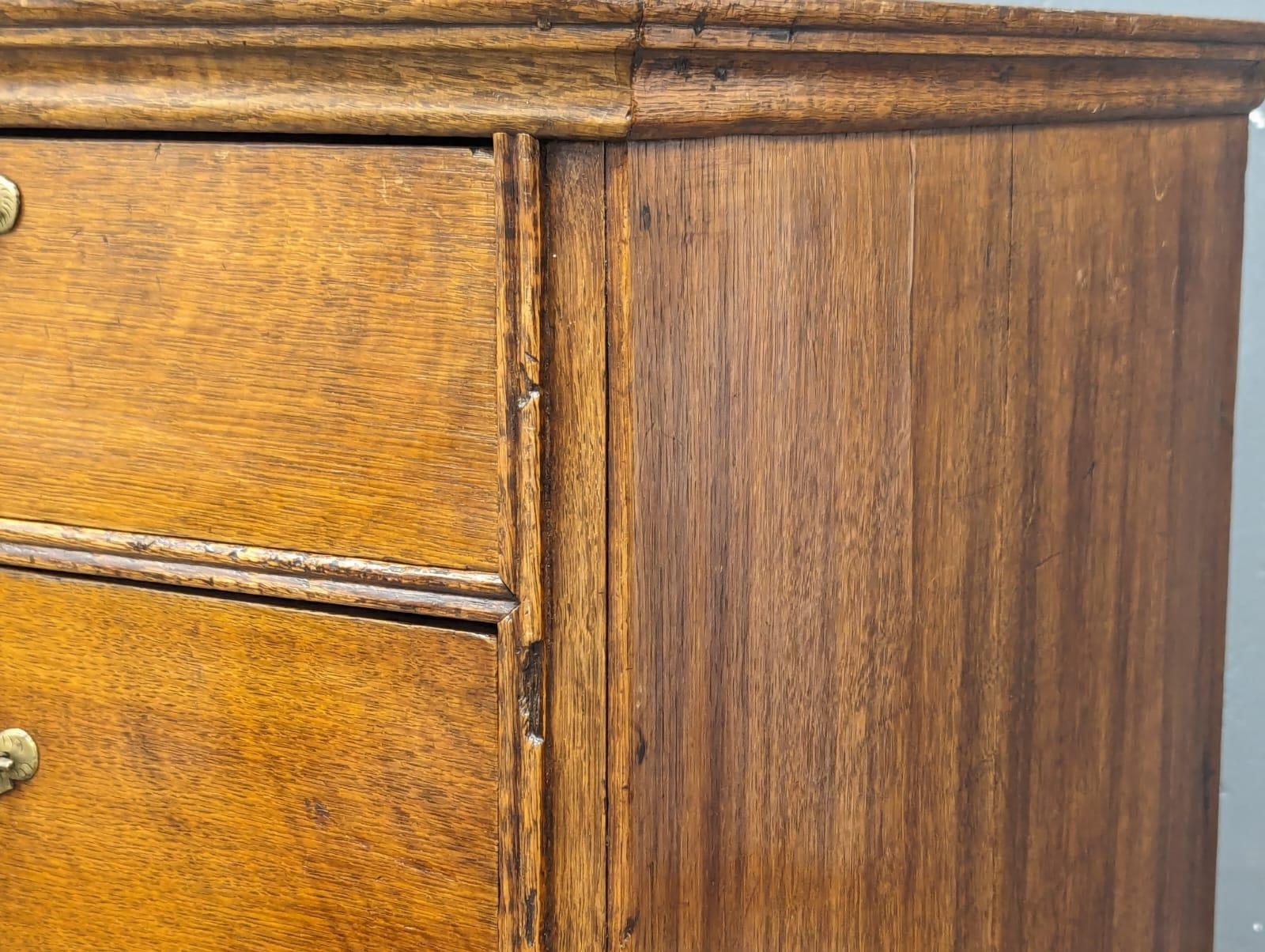 A George II oak chest of drawers with original handles and bracket feet, 94.5cm x 54.5cm x 94.5cm - Image 6 of 8