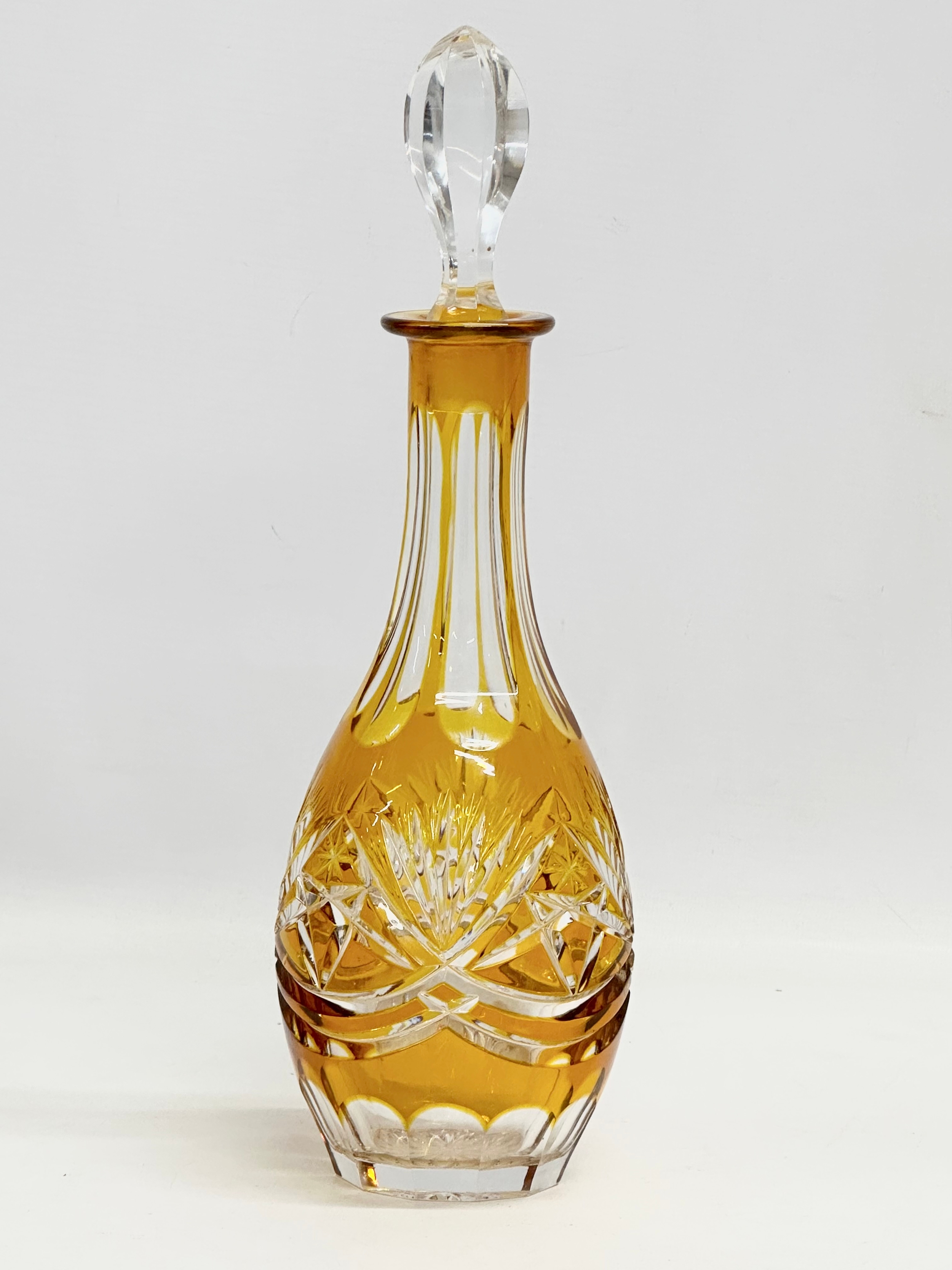 A 20th Century Nachtmann stained amber glass decanter. 31cm