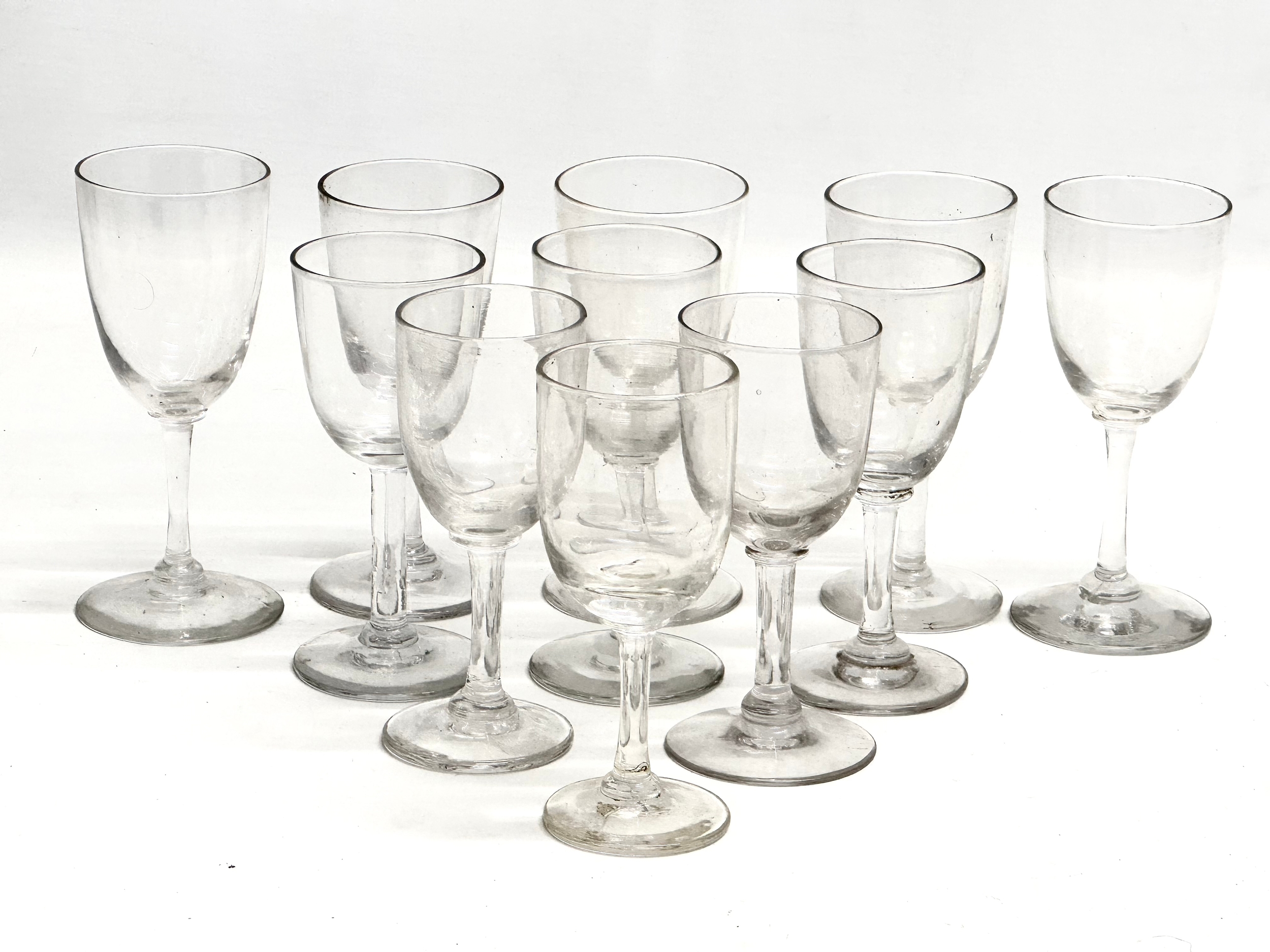 A set of 11 Mid 19th Century Victorian port glasses. Circa 1850-1870. 11.5cm. 12cm