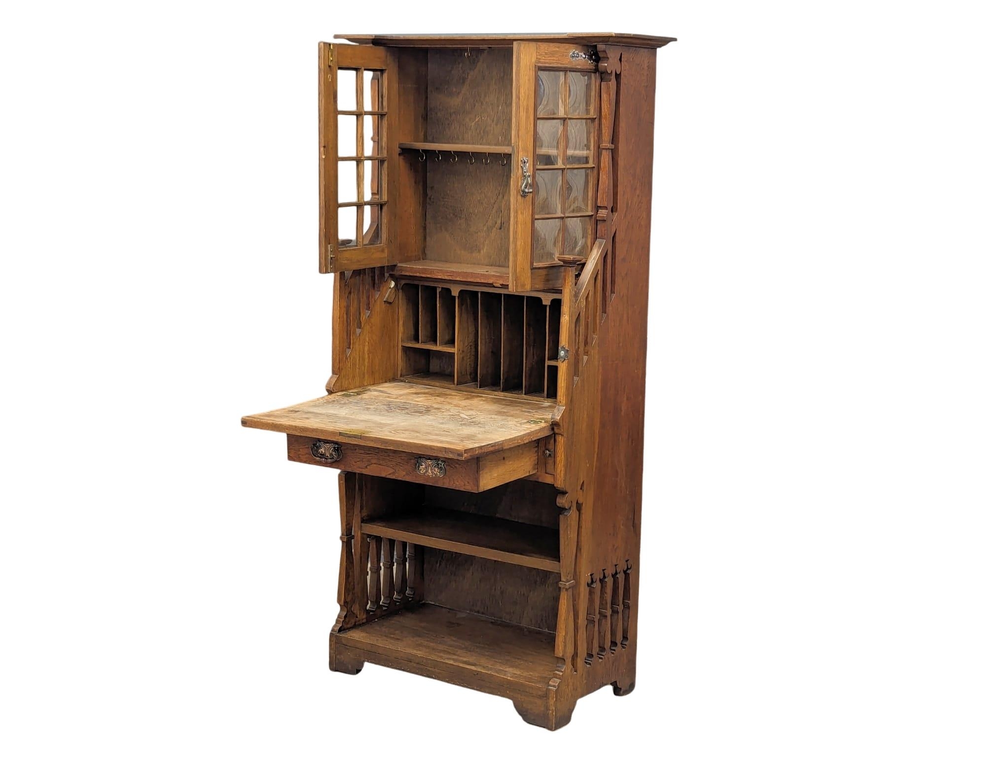 A late 19th Century oak Arts & Crafts bureau bookcase, in the manner of Liberty. Circa 1880-1890s. - Image 10 of 10