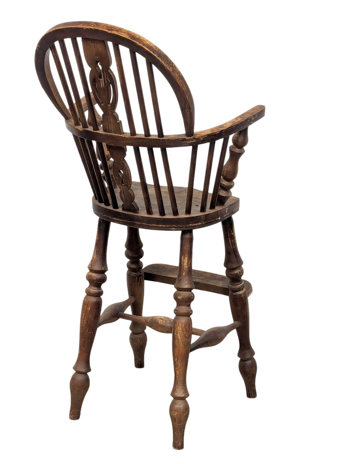 A Late 19th Century elm and beech Windsor style child's highchair. - Image 4 of 4