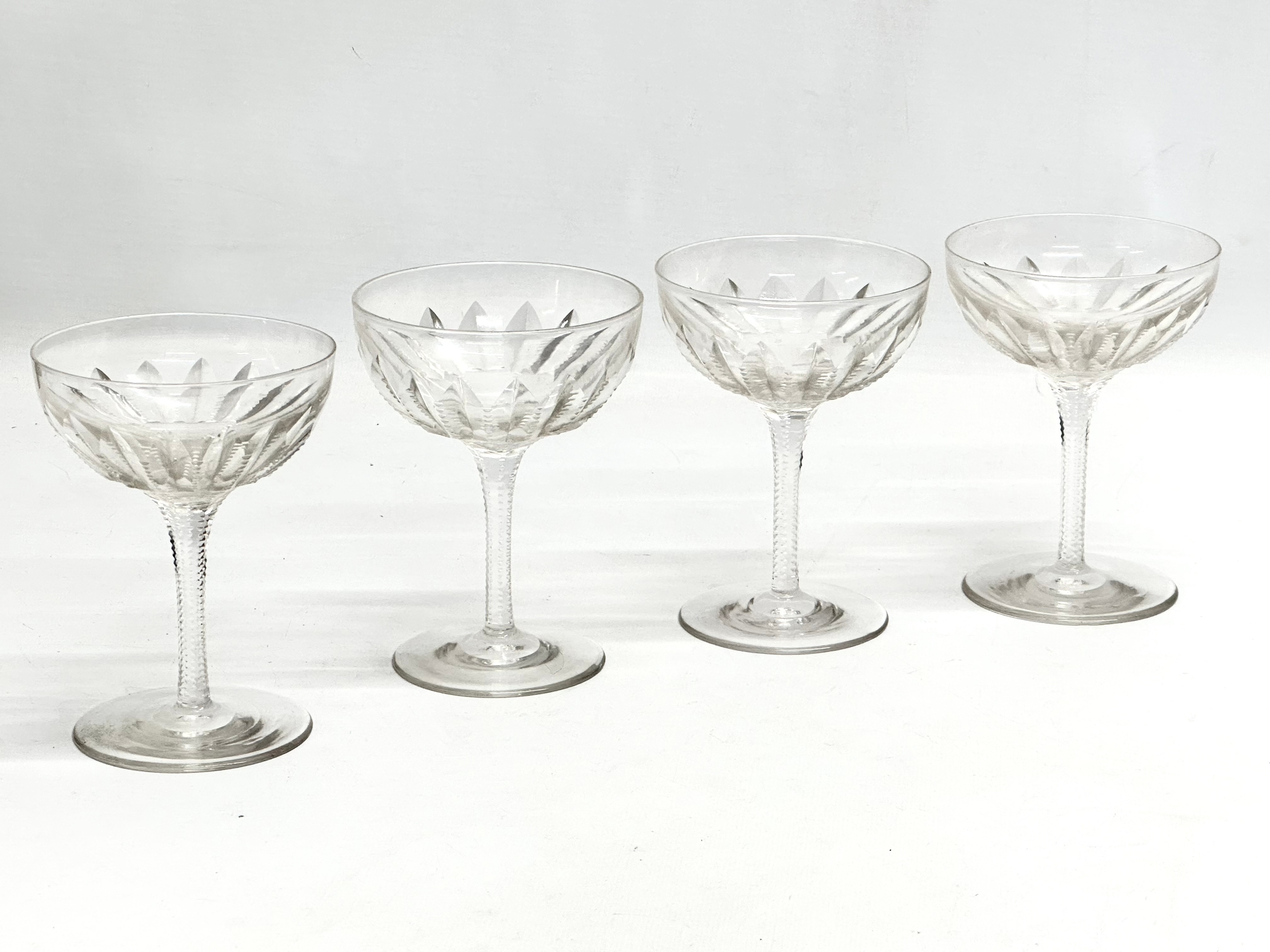 A set of 4 Late 19th/Early 20th Century notch cut cocktail glasses/champagne glasses. 9x12cm