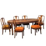 A Chinese rosewood 2 leaf extending dining table and 6 chairs with Mother of Pearl inlay.