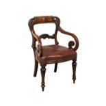 A William IV style mahogany armchair with scroll arms and leather seat
