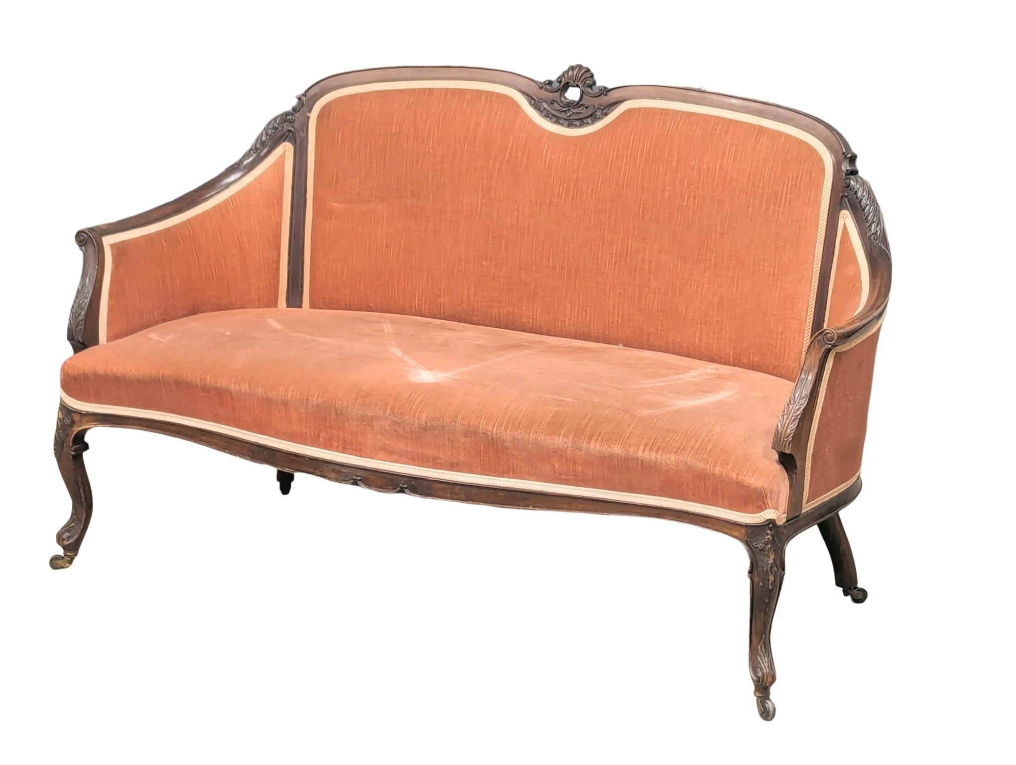 A Late 19th Century / Early 20th Century mahogany sofa on Cabriole legs. 138x67x89cm