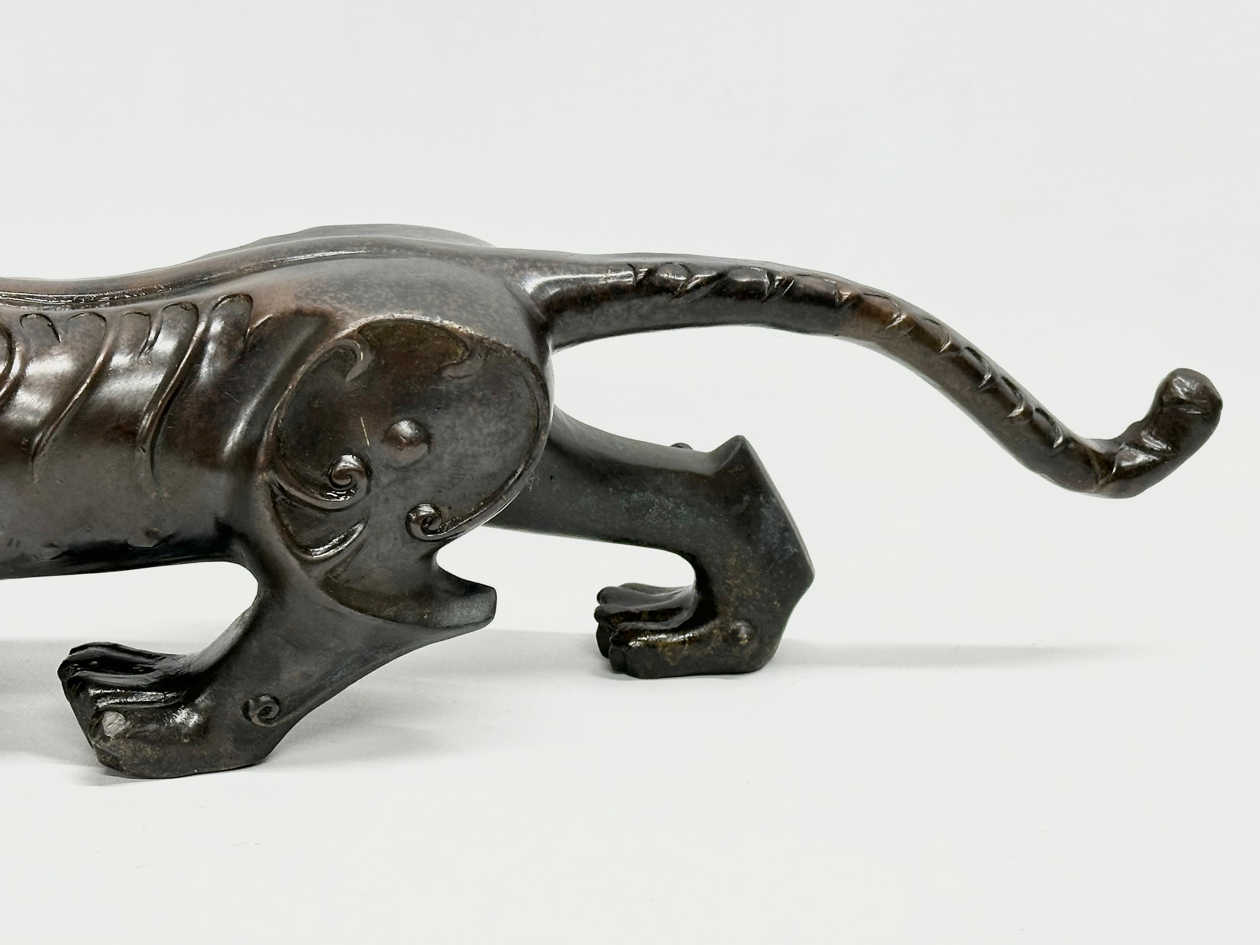 An Early 20th Century Chinese Feng Shui bronze Evil and Wealth Tiger. 38cm - Image 4 of 7