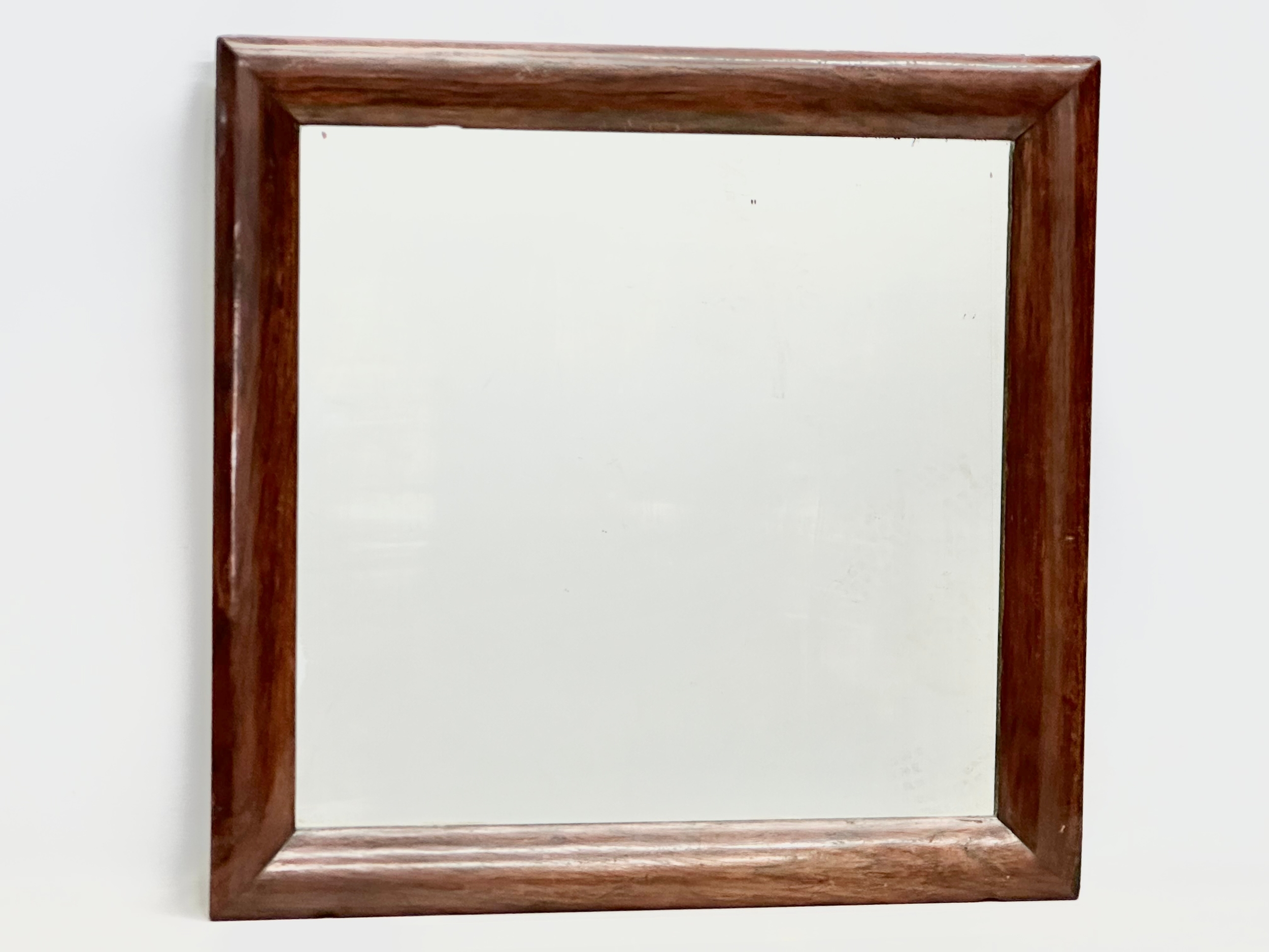 A Victorian rosewood framed mirror. 61x60cm