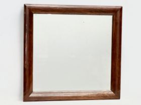A Victorian rosewood framed mirror. 61x60cm