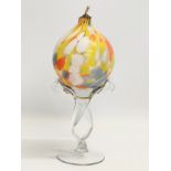 A Splatter glass oil burner. 34cm