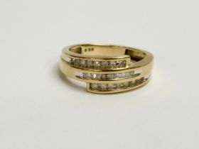 A 9ct gold and diamond ring. 3.09 grams. Size O.