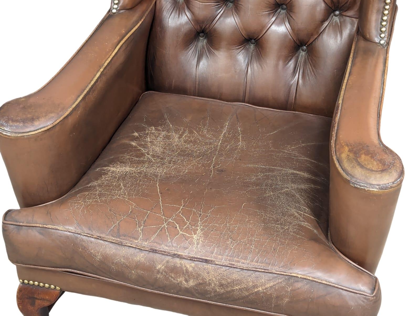 A brown deep button back leather wingback armchair in the early Georgian style - Image 4 of 6