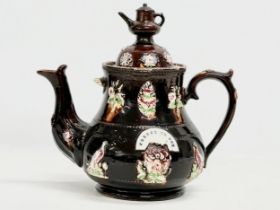 A large Late 19th Century Measham Pottery ‘Bargeware’ teapot. Circa 1880-1890. Forget Me Not.