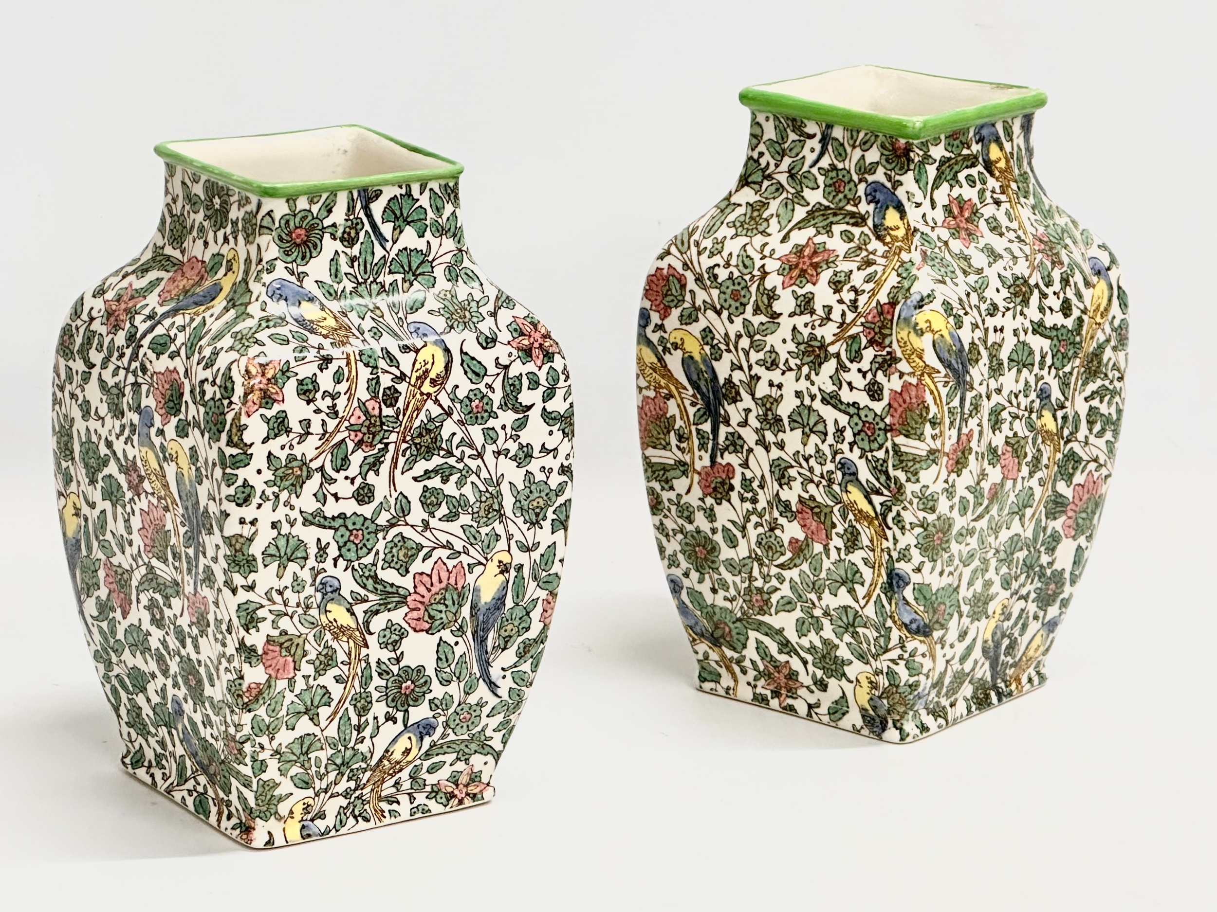 A pair of Early 20th Century Royal Doulton ‘Persian’ vases. 12x12x20cm