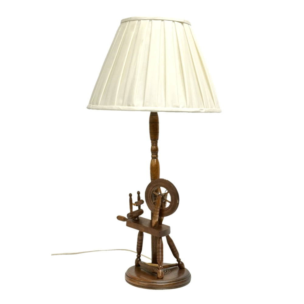 A large spinning wheel table lamp. 79cm