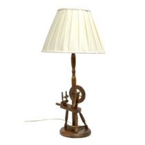 A large spinning wheel table lamp. 79cm