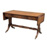 A mahogany writing desk/sofa table with leather top, 3 drawers, 3 dummy drawers and lion paw feet